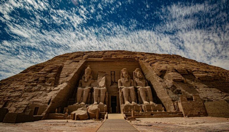 Abu Simbel temple façade with colossal statues of Ramses II in Egypt.