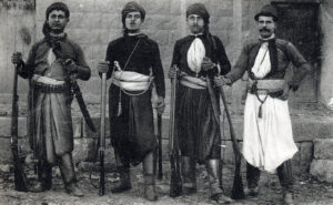 Four men from Mount Lebanon wearing traditional clothing and carrying rifles, photographed in the late 19th century.